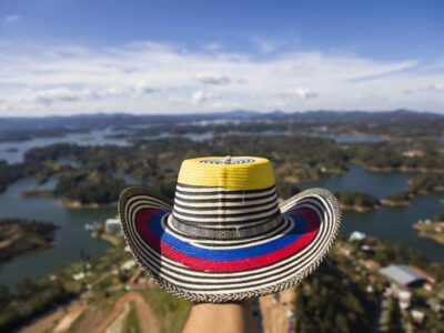 View at hand with Colombian hat over the Guatape lake in Antioquia, Colombia