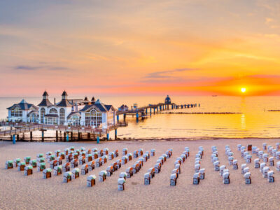 Famous Sellin Seebruecke (Sellin Pier) in beautiful golden morning light at sunrise in summer, Ostseebad Sellin tourist resort, Baltic Sea region, Germany