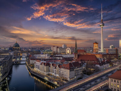 aerial-view-buildings-city-against-cloudy-sky