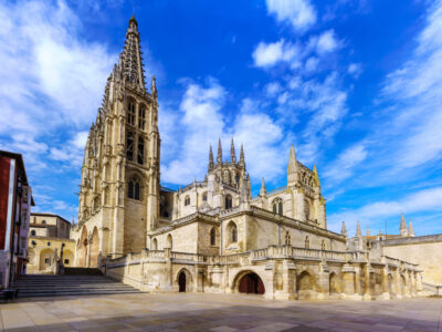 Gothic Cathedral of Burgos by day and with cloudy sky. Wide-angle photo.