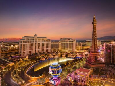 high-angle-view-illuminated-city-buildings-sunset