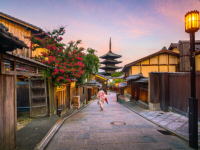 Japanese girl in Yukata with red umbrella in old town  Kyoto, Japan