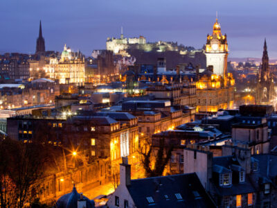 Edinburgh Skylines building and castle from Calton Hill at dusk Scotland UK